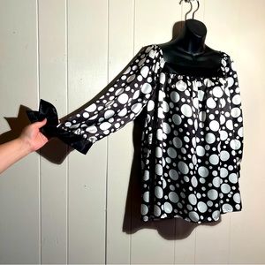Black and White blouse with varying sized white dots. Size XL. Soft like satin.